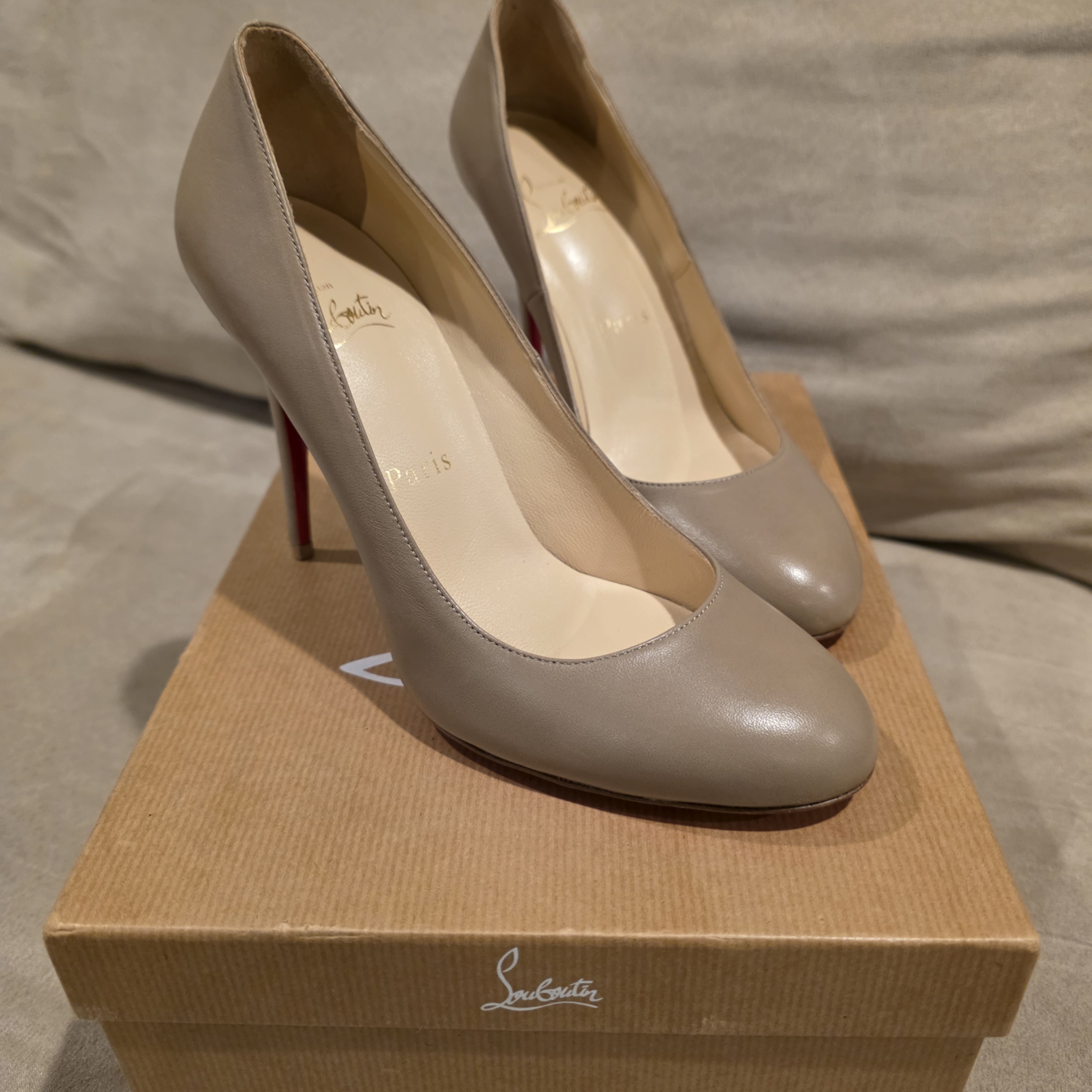 Christian Louboutin Leather Round-Toe Pumps With Red Sole